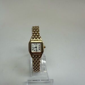 Movado 14k solid gold panther watch with box, papers and extra links